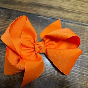 Large orange bow